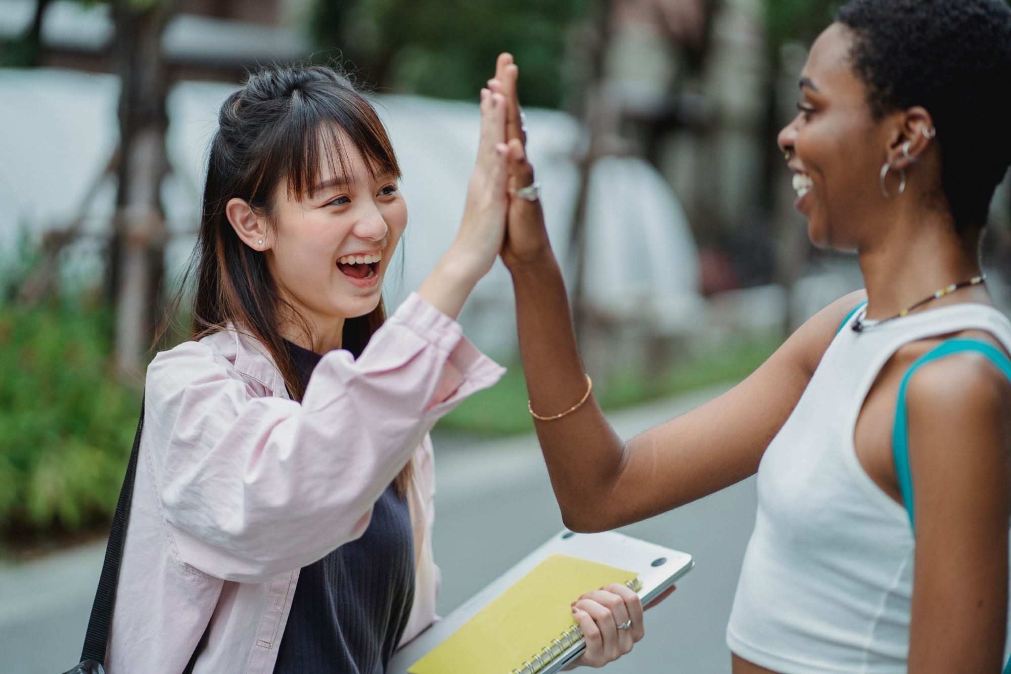 Two people sharing a high-five