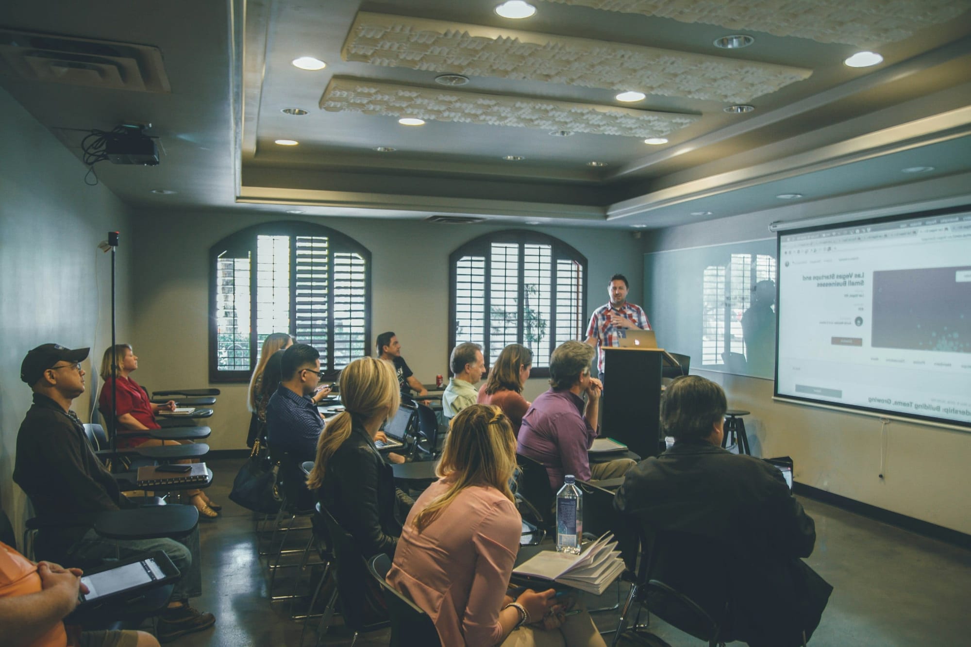 An instructor teaching a class of adult learners