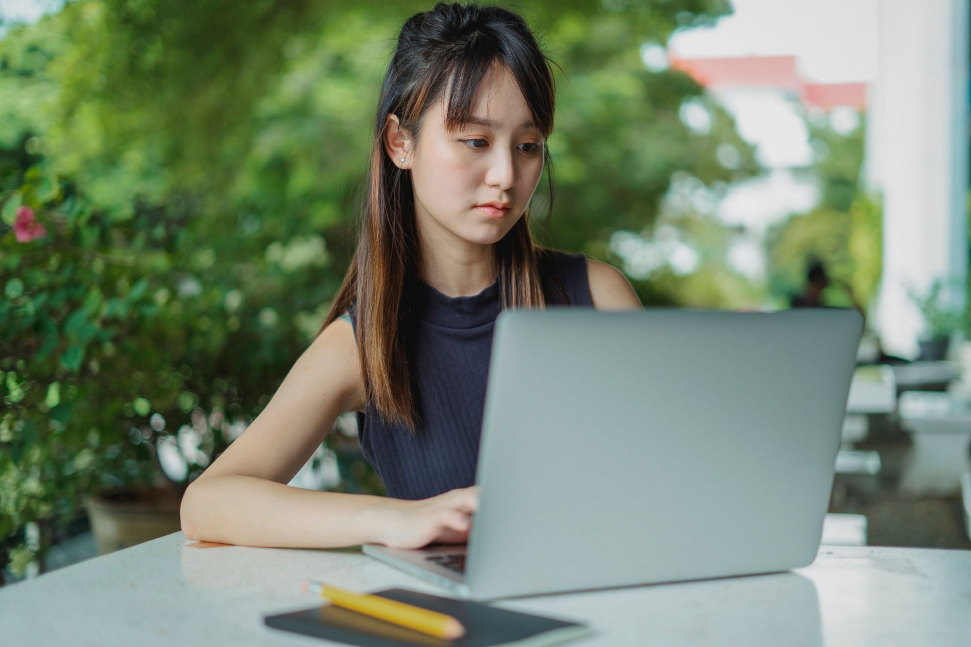 A student working through a lesson on her laptop