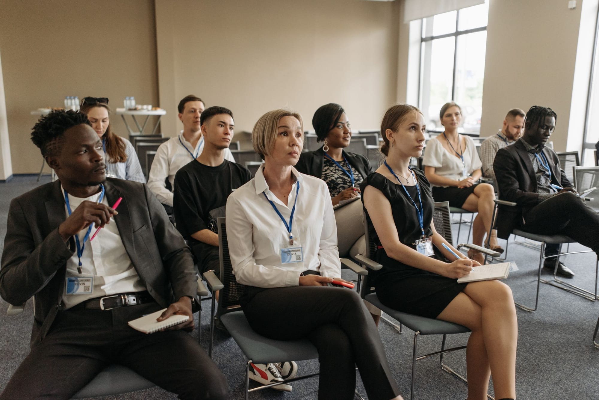 A trainer leading a session for a room of staff